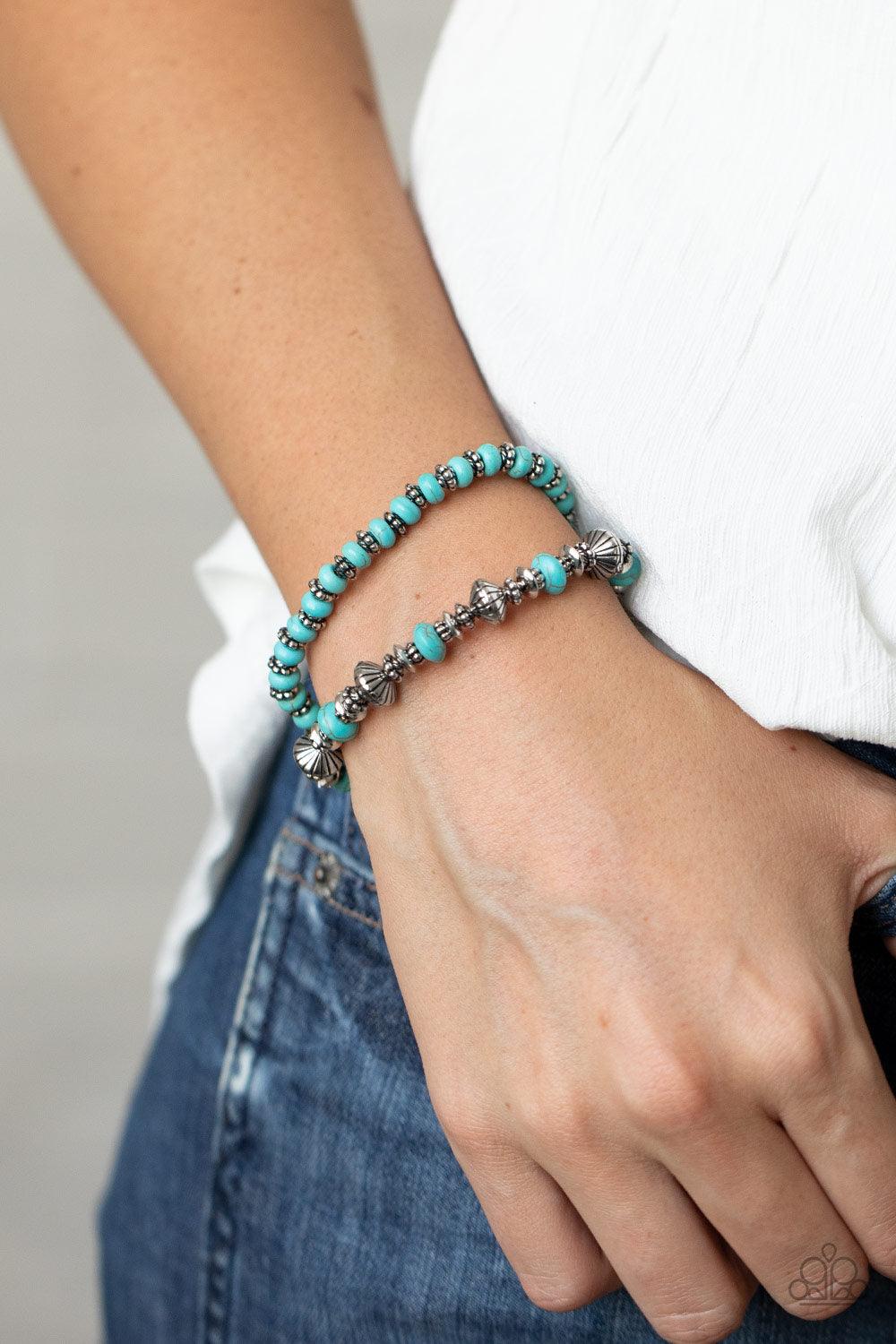 Paparazzi Accessories Cactus Quest - Blue A mismatched assortment of turquoise stone beads and decorative silver beads are threaded along stretchy bands around the wrist, creating an earthy pair. Sold as one set two of bracelets. Jewelry