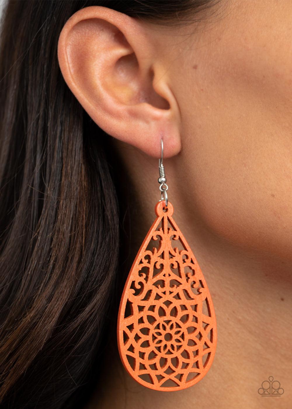 Paparazzi Accessories Seaside Sunsets - Orange A refreshing Amberglow wooden teardrop is cut into a stenciled floral pattern, creating a whimsical lure. Earring attaches to a standard fishhook fitting. Sold as one pair of earrings. Jewelry