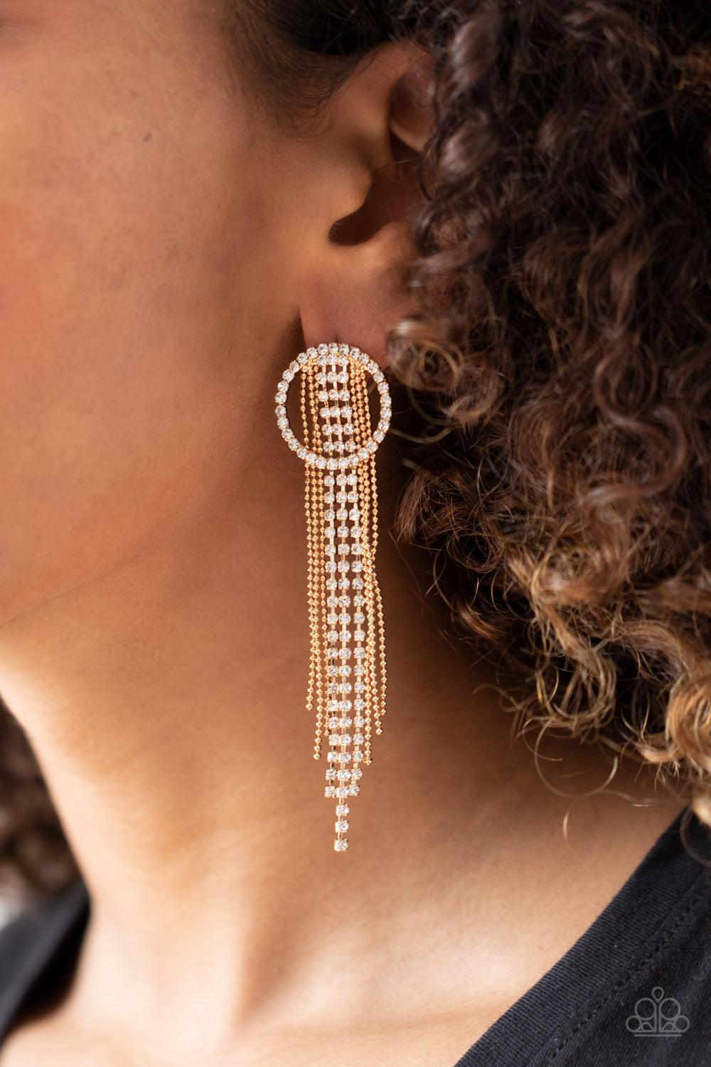 Paparazzi Accessories Dazzle by Default - Gold Dainty strands of glassy white rhinestones and shimmery gold ball-chain stream from the top of a bedazzled white rhinestone hoop, creating a dazzling fringe. Earring attaches to a standard post fitting. Sold