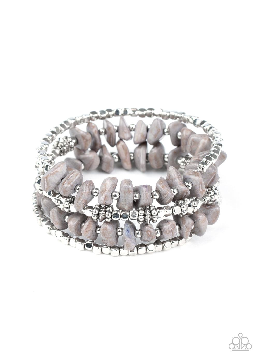 Paparazzi Accessories Rockin Renegade - Silver An earthy collision of Sleet stone beads, silver cubes, and decorative silver accents are threaded along a silver wire that coils around the wrist, creating a whimsical infinity wrap bracelet. Sold as one ind