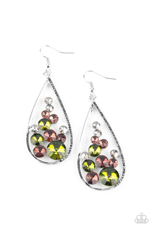 Paparazzi Accessories Tempest Twinkle - Multi An oversized collection of glittery purple, green, and smoky rhinestones collect inside a shimmery silver teardrop. One side of the frame is encrusted in dainty hematite rhinestones, adding an elegant edge to