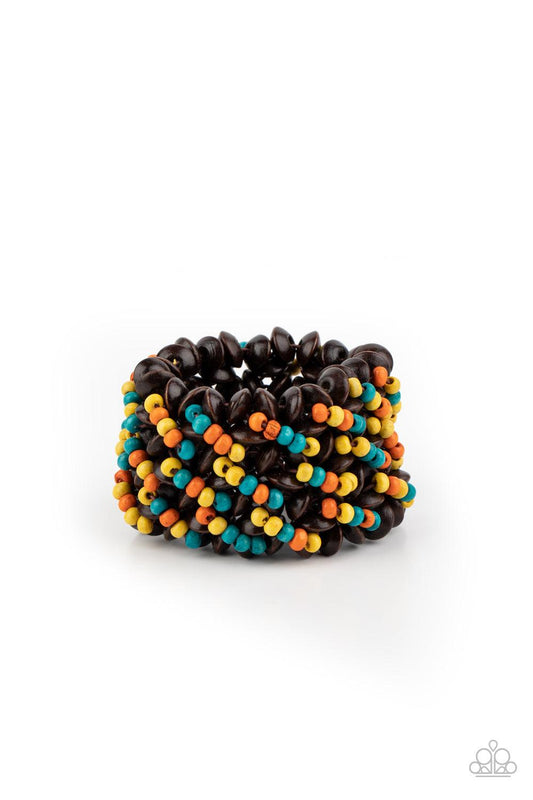 Paparazzi Accessories Cozy in Cozumel - Multi A collection of dainty blue, orange, and yellow wooden beads and brown wooden discs are threaded along knotted stretchy bands, creating a tropical floral pattern around the wrist. Sold as one individual bracel