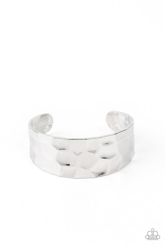 Paparazzi Accessories Is It HAUTE In Here? - Silver Hammered in edgy geometric detail, a shimmery silver cuff curls around the wrist for a bold pop of industrial inspiration. Sold as one individual bracelet. Jewelry