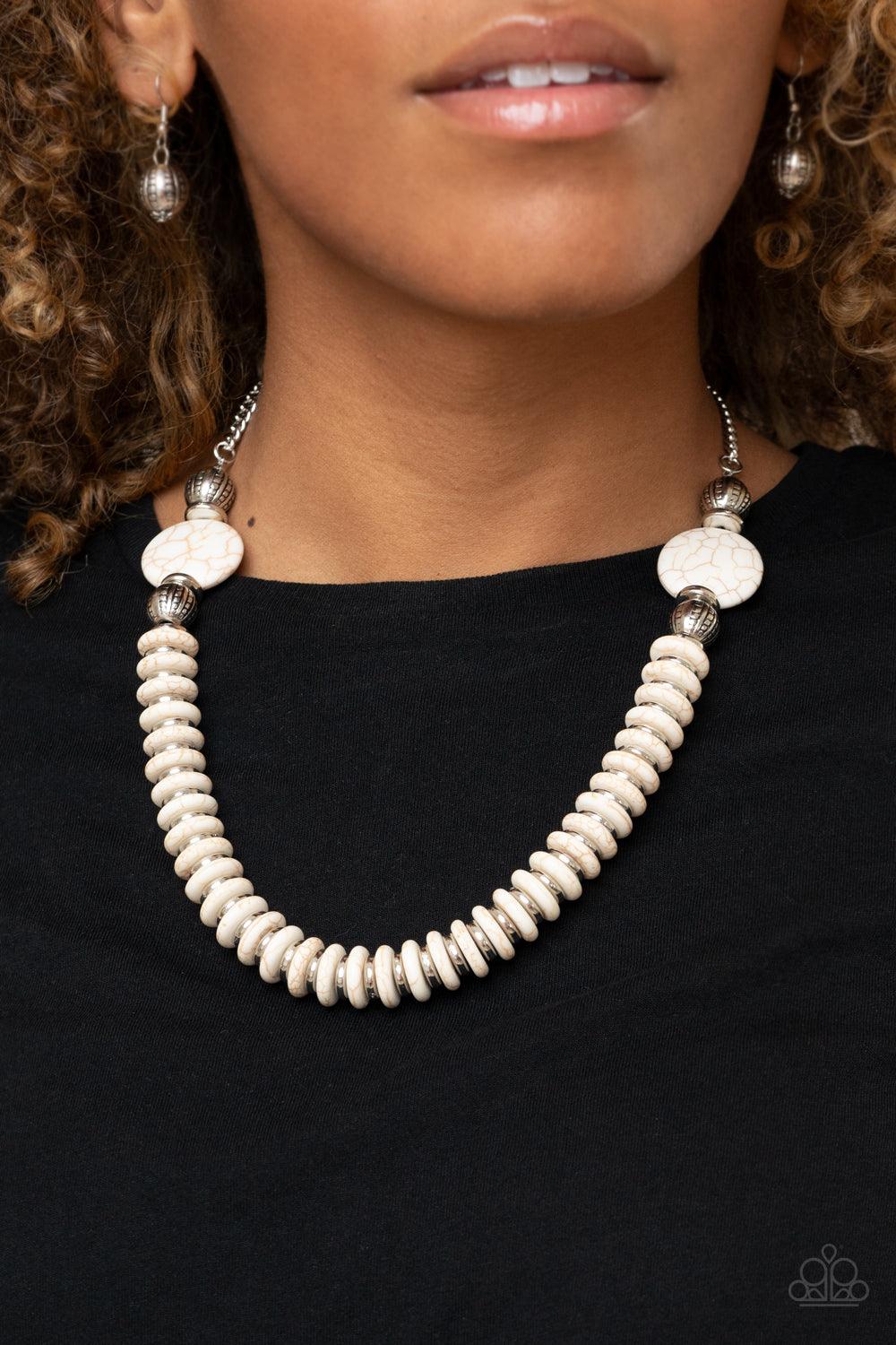 Paparazzi Accessories Desert Revival - White Flanked by ornate silver beads, two oversized white stones give way to an alternating strand of shiny silver and refreshing white stone discs for an authentically artisan inspired look below the collar. Feature