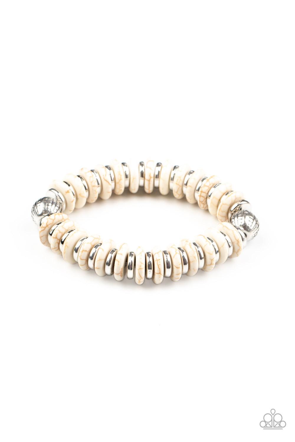 Paparazzi Accessories Eco Experience - White Infused with a pair of ornate silver beads, an earthy collection of shiny silver and refreshing white stone discs alternate along a stretchy band around the wrist for an authentically artisan inspired look. Sol