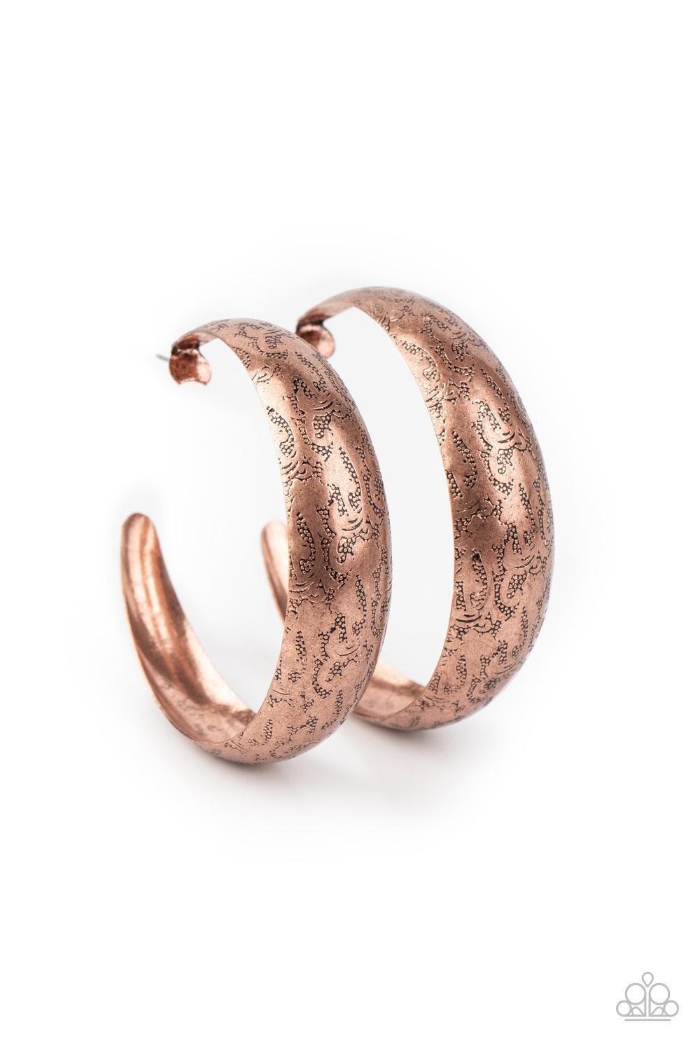 Paparazzi Accessories Sahara Sandstorm - Copper Delicately hammered in studded-like patterns, an oversized antiqued copper hoop boldly curls around the ear for a whimsically rustic look. Earring attaches to a standard post fitting. Hoop measures approxima