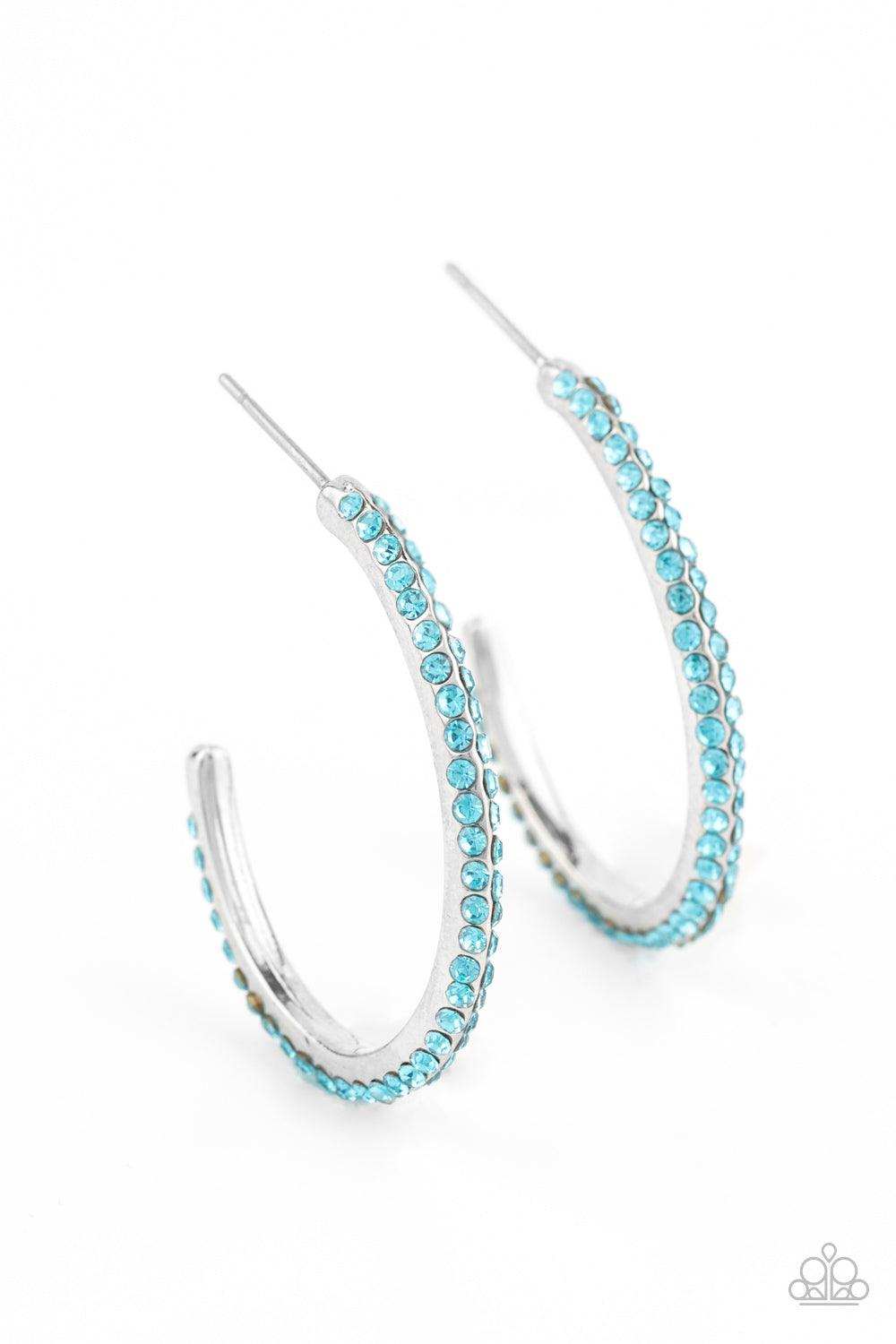Paparazzi Accessories Dont Think Twice - Blue Two rows of glittery blue rhinestones are encrusted along the edge of a hook shaped silver hoop, creating a glamorously dainty display. Earring attaches to a standard post fitting. Hoop measures approximately