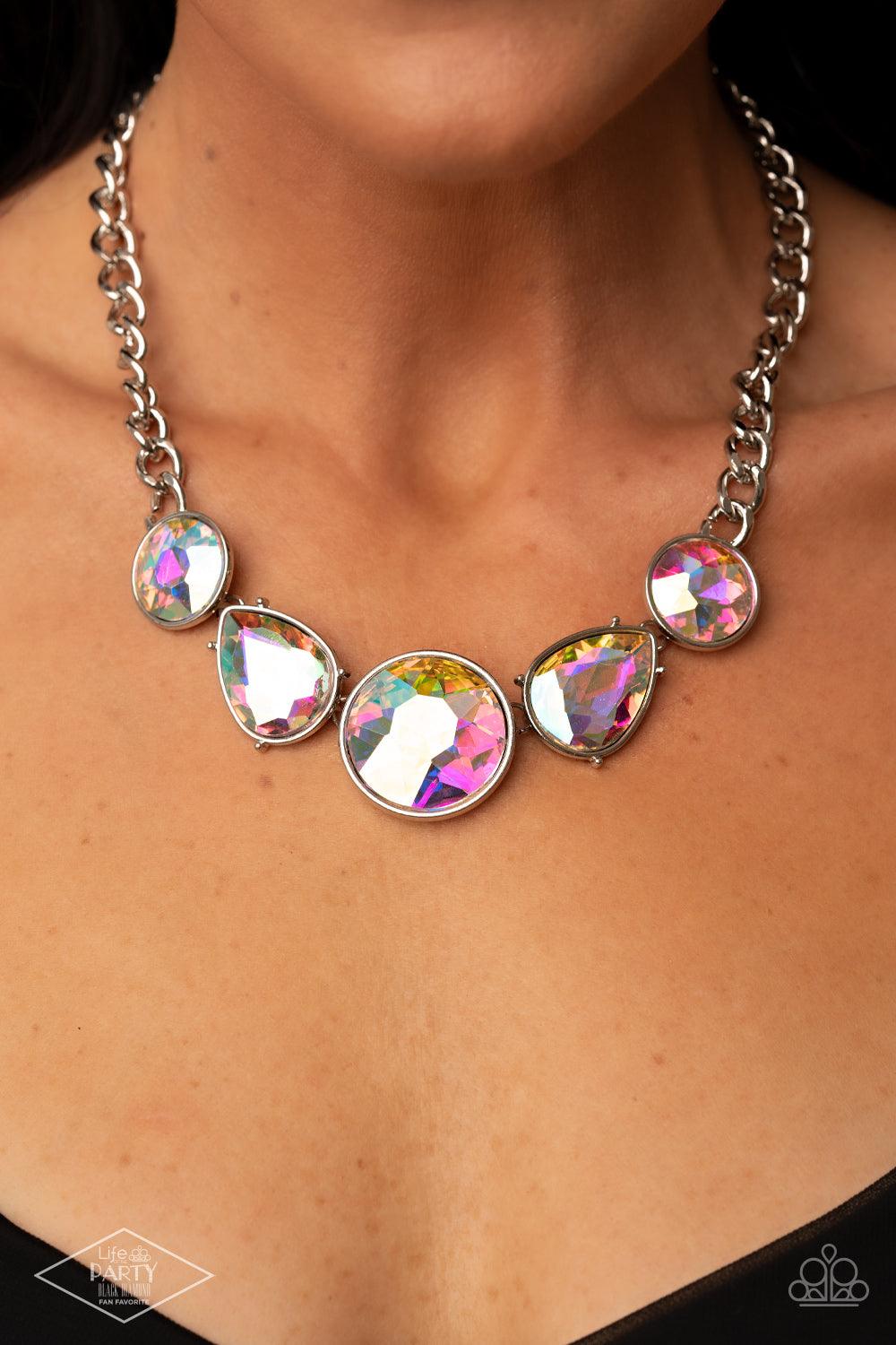 Paparazzi Accessories All The Worlds My Stage - Multi Infused with heavy silver chain, an exaggerated display of round and teardrop shaped iridescent rhinestones connects below the collar for a blinding look. Features an adjustable clasp closure. Sold as