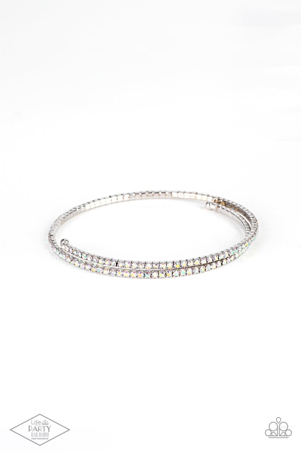 Paparazzi Accessories Sleek Sparkle - Multi Dotted in dainty iridescent rhinestones, a flexible wire coils around the wrist for a refined flair. Sold as one individual bracelet. Jewelry