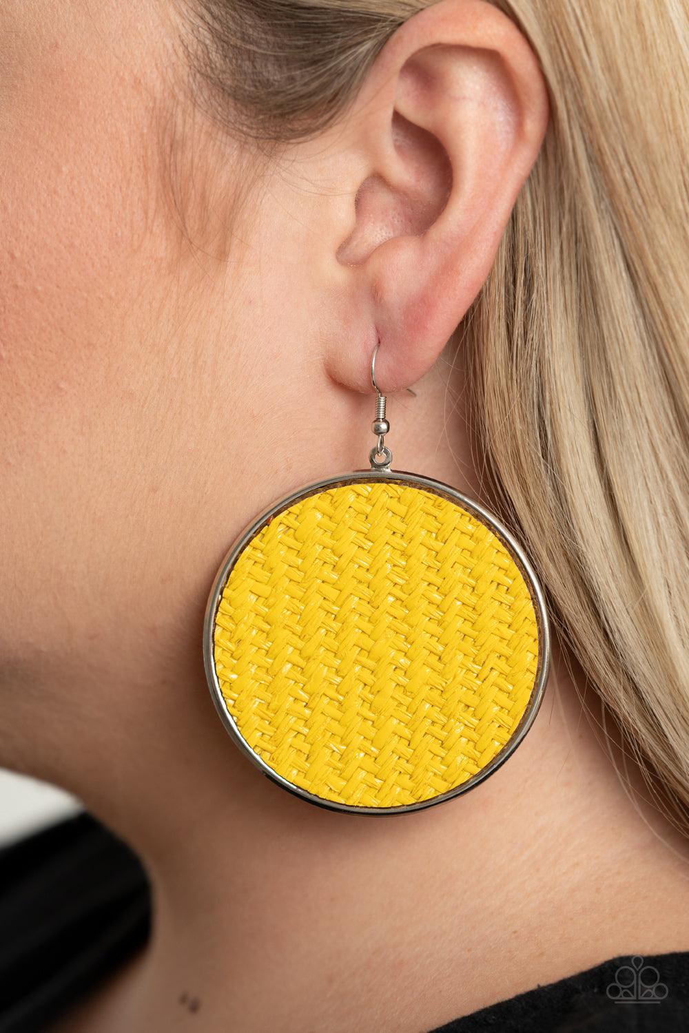 Paparazzi Accessories Wonderfully Woven - Yellow Shiny yellow twine-like cording weaves across the front of an oversized silver disc for an earthy flair. Earring attaches to a standard fishhook fitting. Sold as one pair of earrings. Jewelry