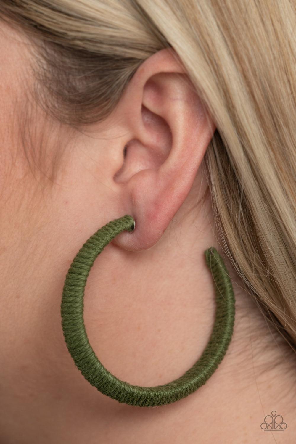 Paparazzi Accessories TWINE and Dine - Green Earthy Military Olive twine-like cording is wrapped around a thick hoop, creating a colorful rustic display. Earring attaches to a standard post fitting. Hoop measures approximately 2 1/4" in diameter. Sold as
