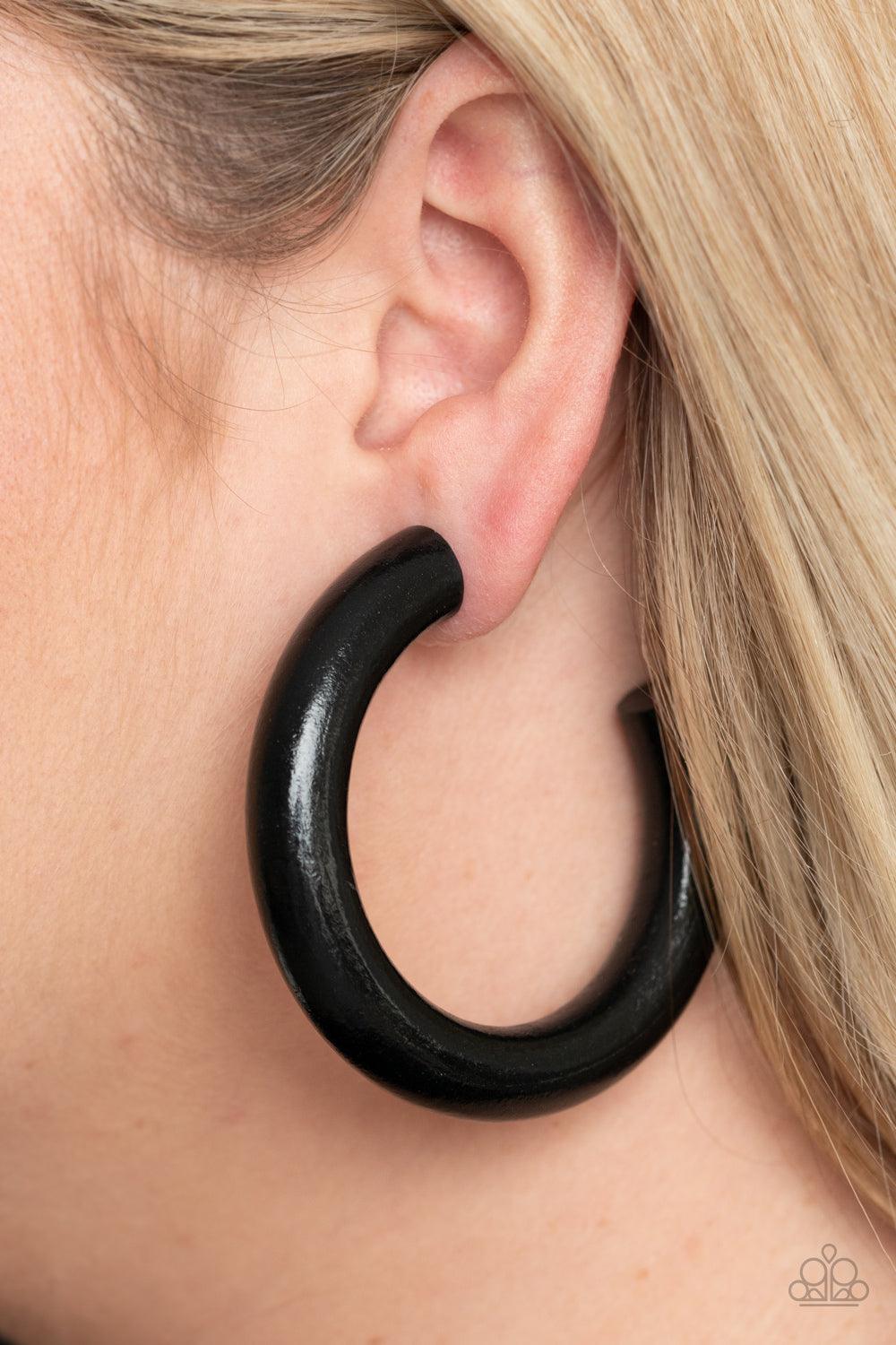 Paparazzi Accessories I WOOD Walk 500 Miles - Black Painted in a shiny black finish, a thick wooden frame dramatically curls into an oversized hoop for a colorfully retro look. Earring attaches to a standard post fitting. Hoop measures approximately 2 1/2