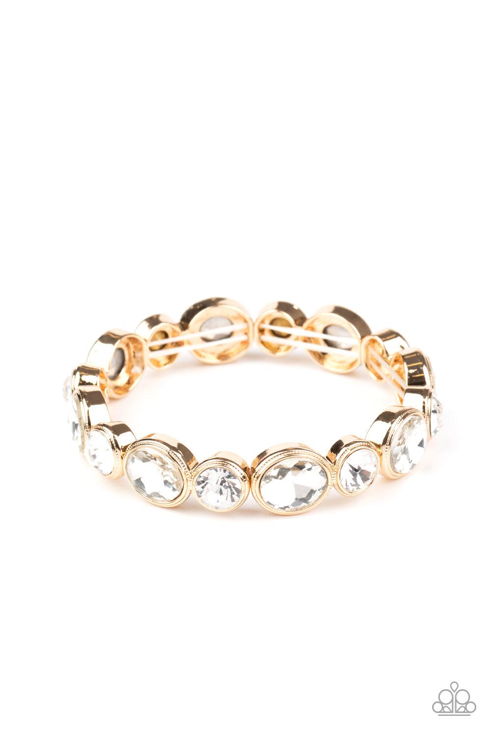 Paparazzi Accessories Still GLOWING Strong - Gold Encased in sleek gold frames, oval and round white rhinestones alternate along a stretchy band around the wrist for a timeless look. Sold as one individual bracelet. Jewelry