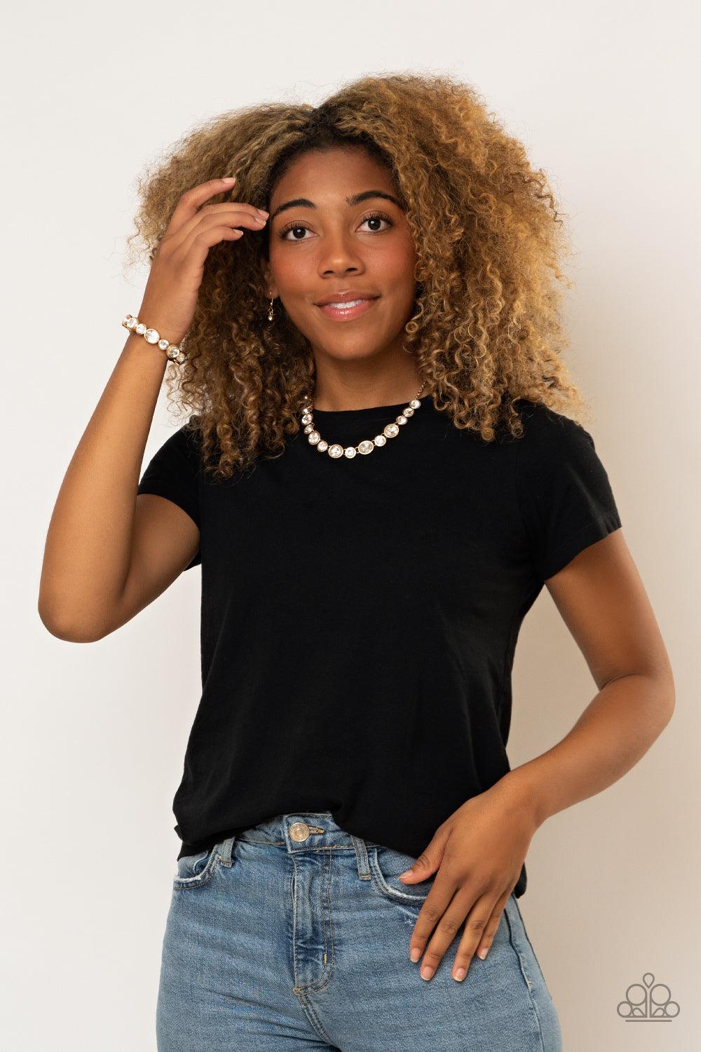 Paparazzi Accessories Still GLOWING Strong - Gold Encased in sleek gold frames, oval and round white rhinestones alternate along a stretchy band around the wrist for a timeless look. Sold as one individual bracelet. Jewelry
