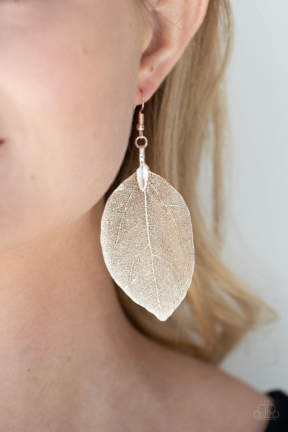Paparazzi Accessories Leafy Legacy - Rose Gold Featuring lifelike details, a delicate rose gold frame branches out into a majestic leaf for a seasonal finish. Earring attaches to a standard fishhook fitting. Sold as one pair of earrings. Jewelry