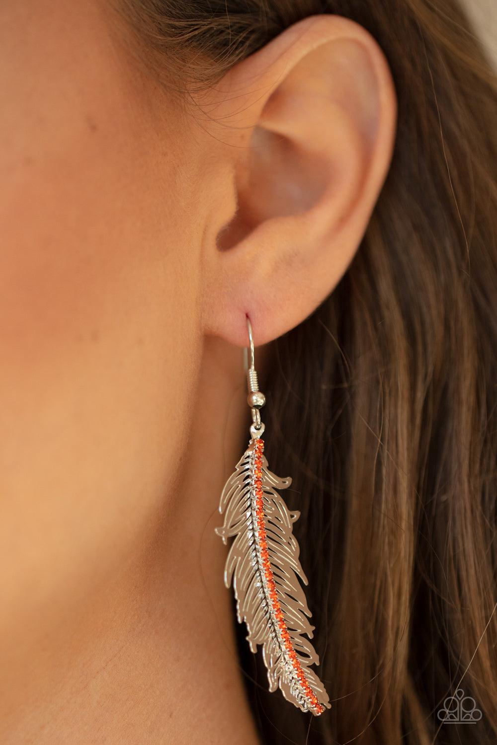 Paparazzi Accessories Fearless Flock - Orange A row of dainty orange rhinestones are encrusted down the spine of a lifelike silver feather, creating a refined frame. Earring attaches to a standard fishhook fitting. Sold as one pair of earrings. Jewelry
