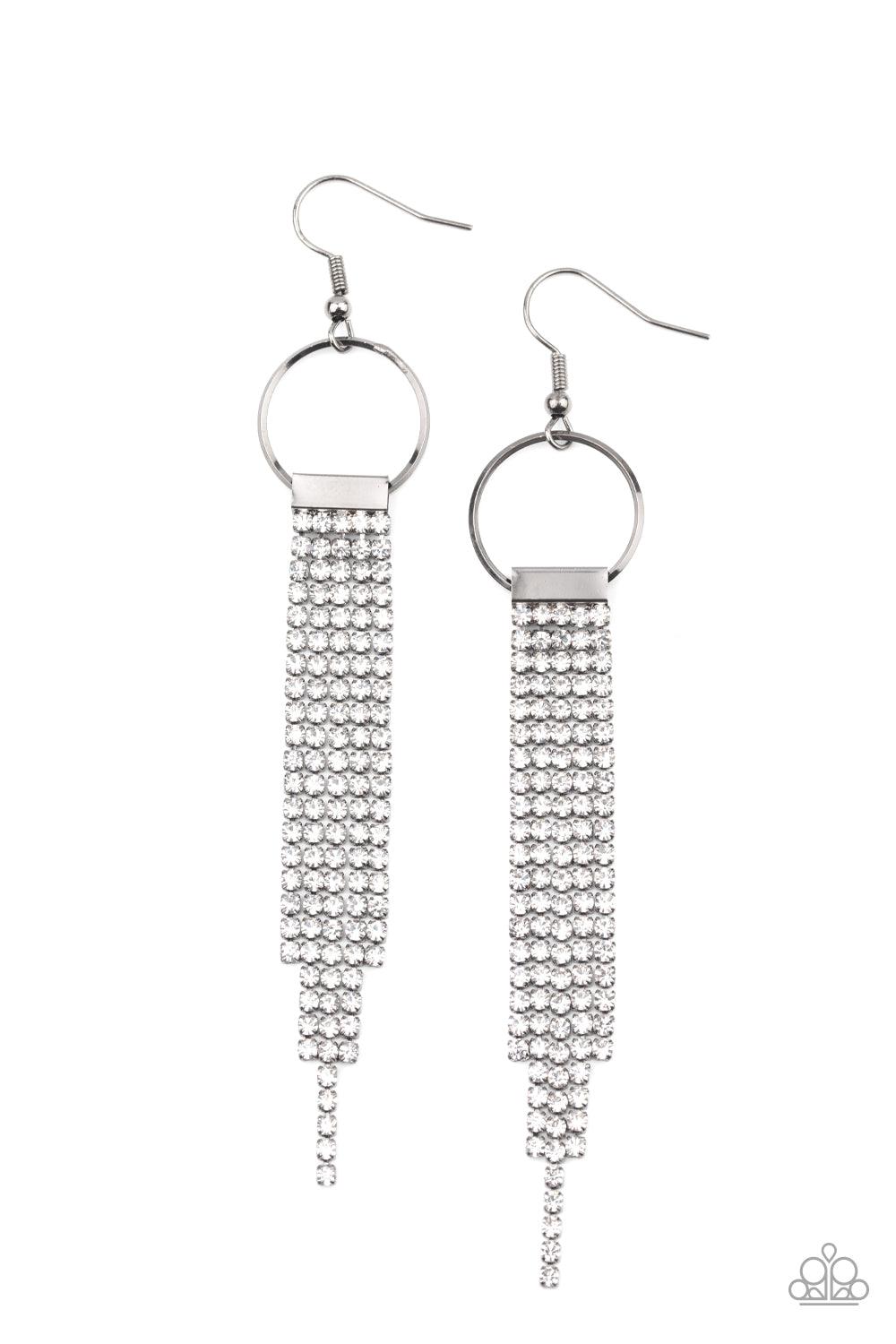 Paparazzi Accessories Tapered Twinkle - White Dainty strands of glittery white rhinestones stream from the bottom of a silver fitting that glides along the bottom of a dainty silver hoop, creating a timelessly tapered fringe. Earring attaches to a standar