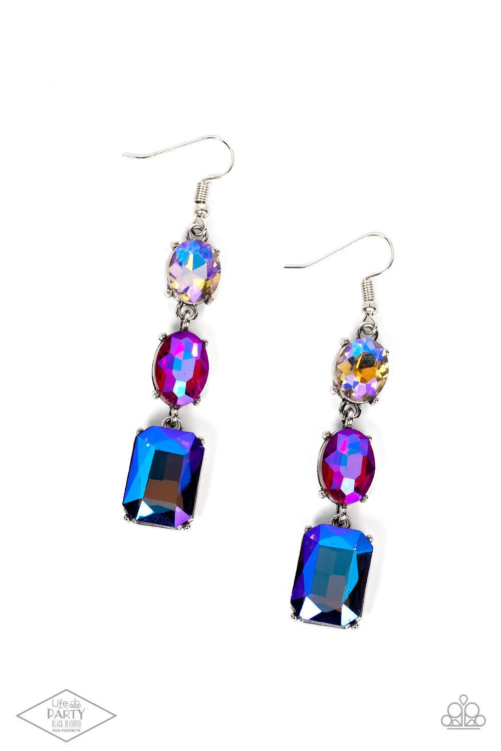 Paparazzi Accessories Dripping In Melodrama - Multi An iridescent blue emerald style gem swings from the bottom of a mismatched pair of iridescent multicolored and pink oval rhinestones, creating a stellar lure. Earring attaches to standard fishhook fitti