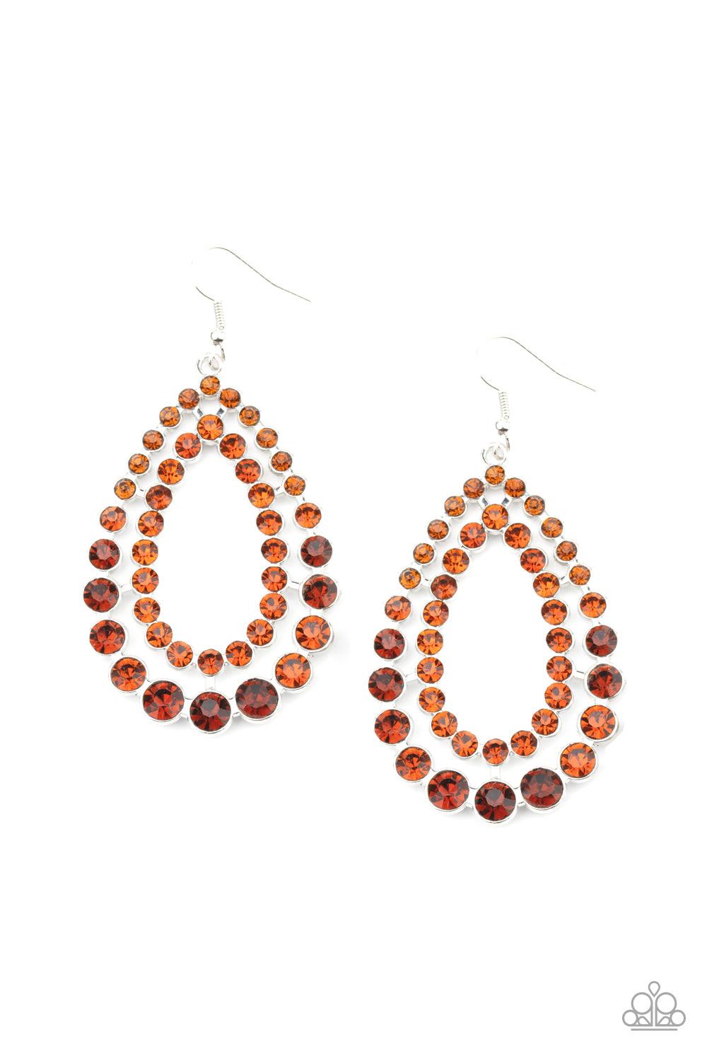 Paparazzi Accessories Glacial Glaze - Brown Varying in size, rows of glittery topaz rhinestones coalesce into two blinding teardrops for a jaw-dropping dazzle. Earring attaches to a standard fishhook fitting. Sold as one pair of earrings. Jewelry