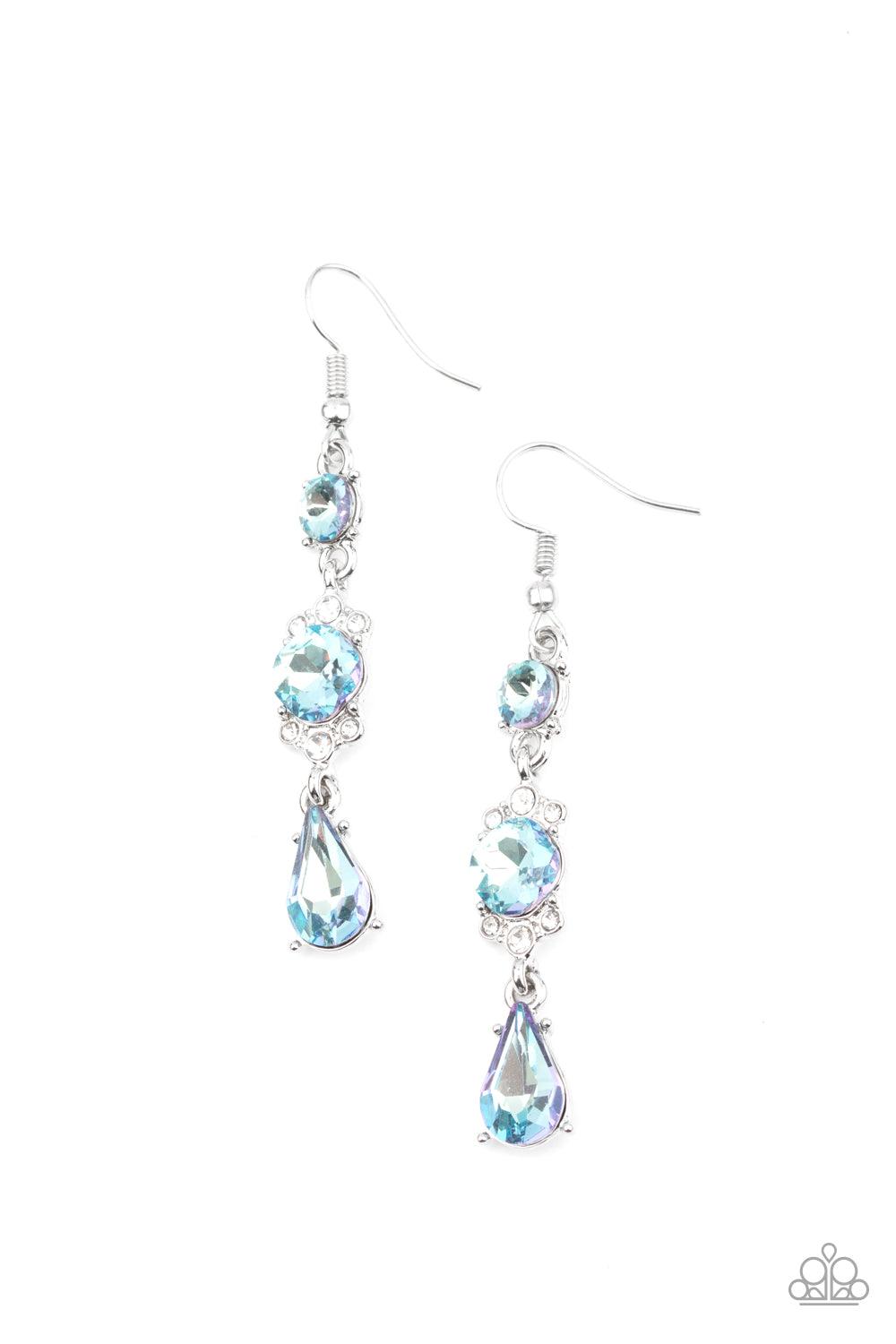Paparazzi Accessories Outstanding Opulence - Blue Featuring a white rhinestone encrusted frame, an oversized blue rhinestone is linked between a classic round and teardrop blue rhinestone for an elegantly stacked look. Earring attaches to a standard fishh