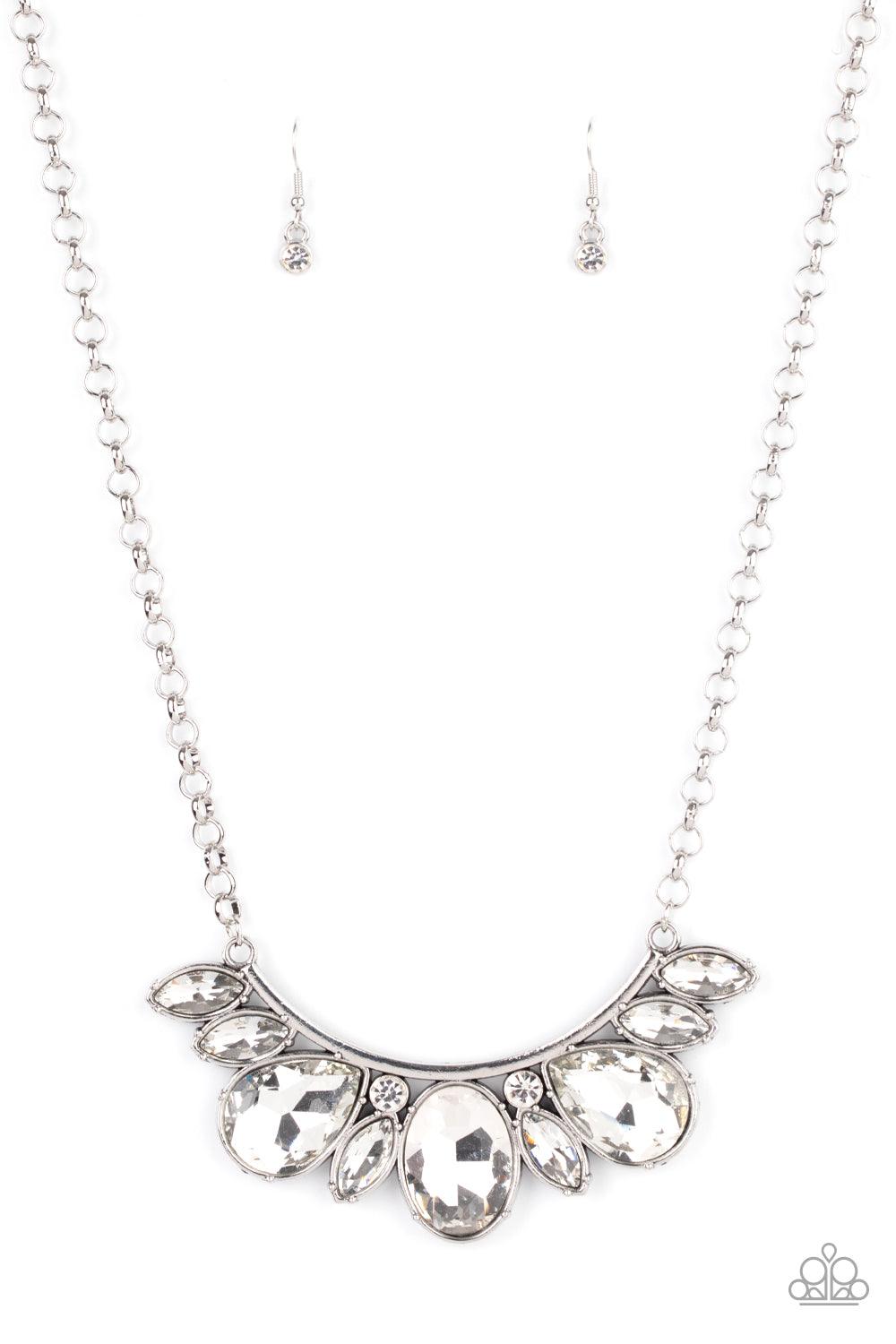 Paparazzi Accessories Never SLAY Never - White An oversized collection of round, marquise, and teardrop white rhinestones drip from the bottom of a bowing silver bar, coalescing into a sassy statement piece below the collar. Features an adjustable clasp c
