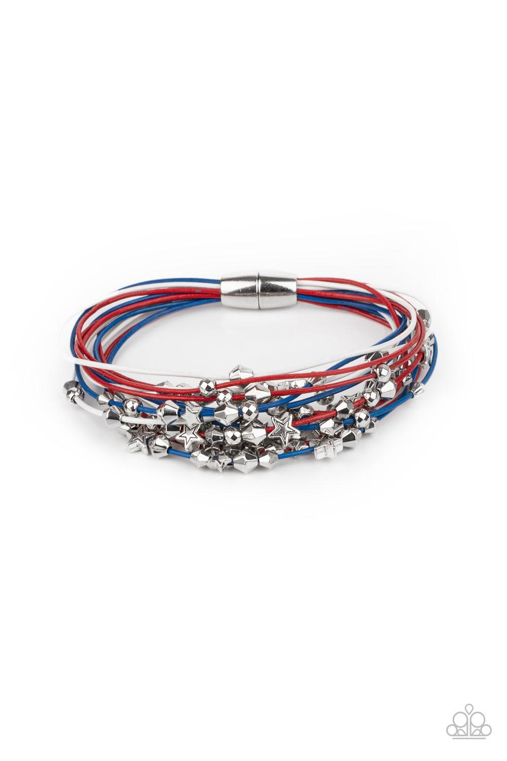 Paparazzi Accessories Star-Studded Affair - Multi A collection of faceted silver beads and silver star charms slides along red, white, and blue cords that layer across the wrist of a colorful look. Features a magnetic closure. Sold as one individual brace