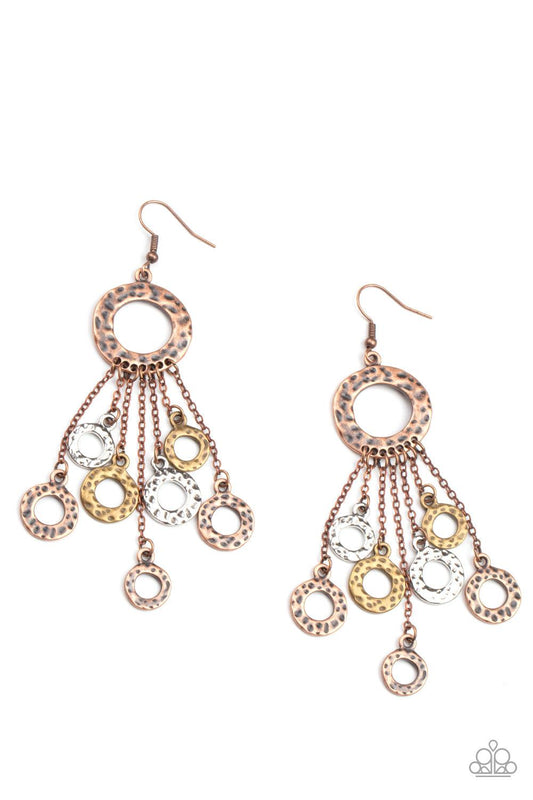 Paparazzi Accessories Right Under Your NOISE - Multi Attached to dainty copper chains, a fringe of hammered brass, copper, and silver rings swings from the bottom of a hammered copper ring for a noise-making statement. Earring attaches to a standard fishh