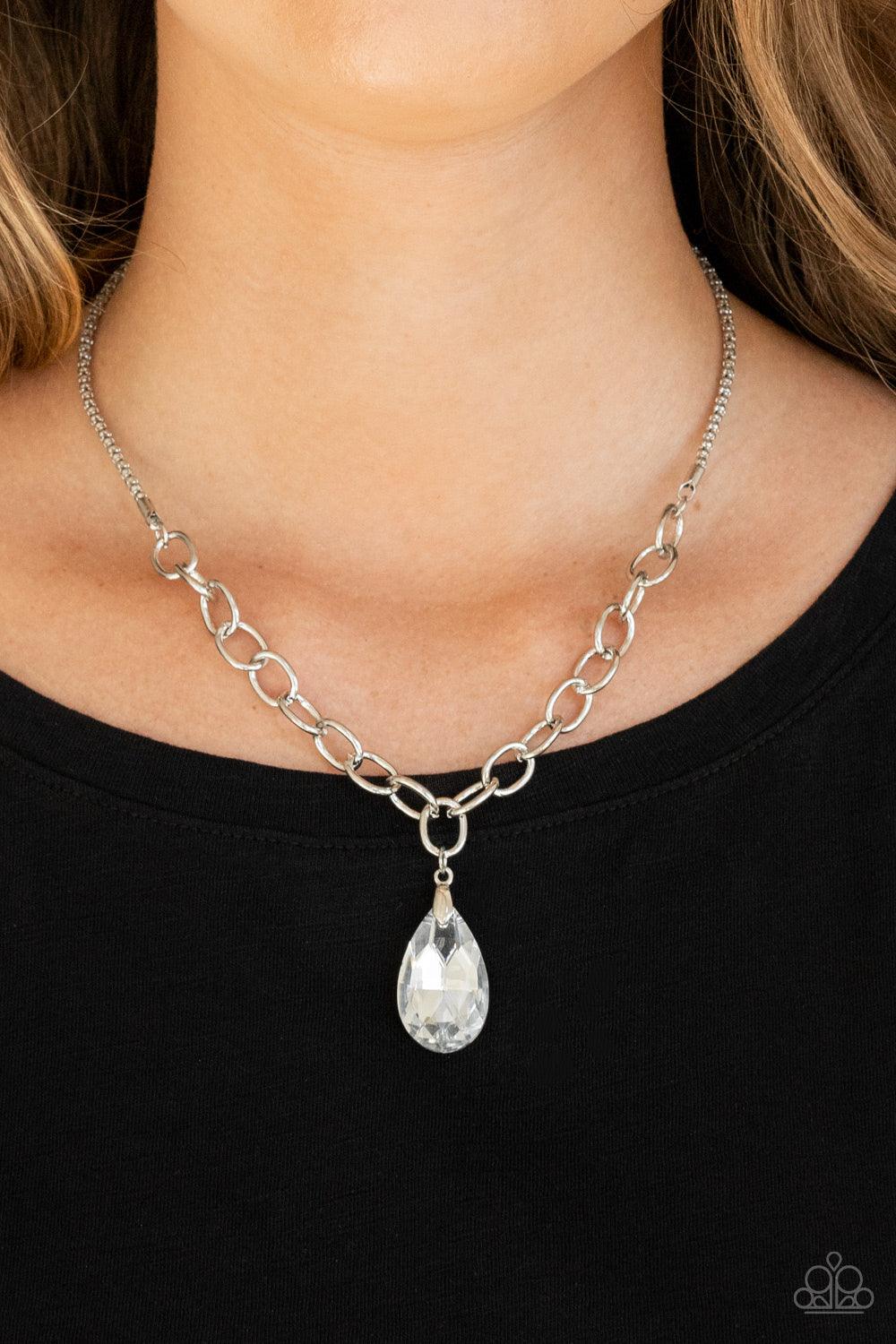 Paparazzi Accessories Mega Modern - Silver A glassy white teardrop swings from the bottom of a chunky silver chain that attaches to a shimmery silver popcorn chain, creating a modern display below the collar. Features an adjustable clasp closure. Sold as