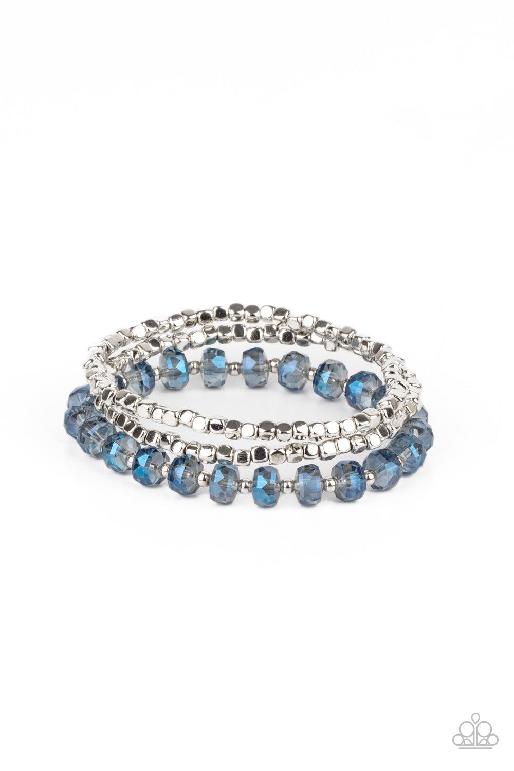 Paparazzi Accessories Celestial Circus - Blue A pair of silver cube beads join one strand of blue crystal-like beads around the wrist, creating iridescently stretchy layers. Sold as one set of three bracelets. Jewelry