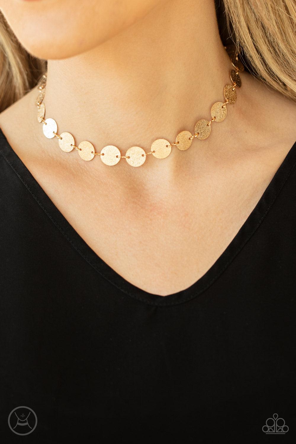 Paparazzi Accessories Reflection Detection - Gold Hammered in shimmery detail, a shiny collection of dainty gold discs delicately link into a blinding display around the neck. Features an adjustable clasp closure. Sold as one individual choker necklace. I