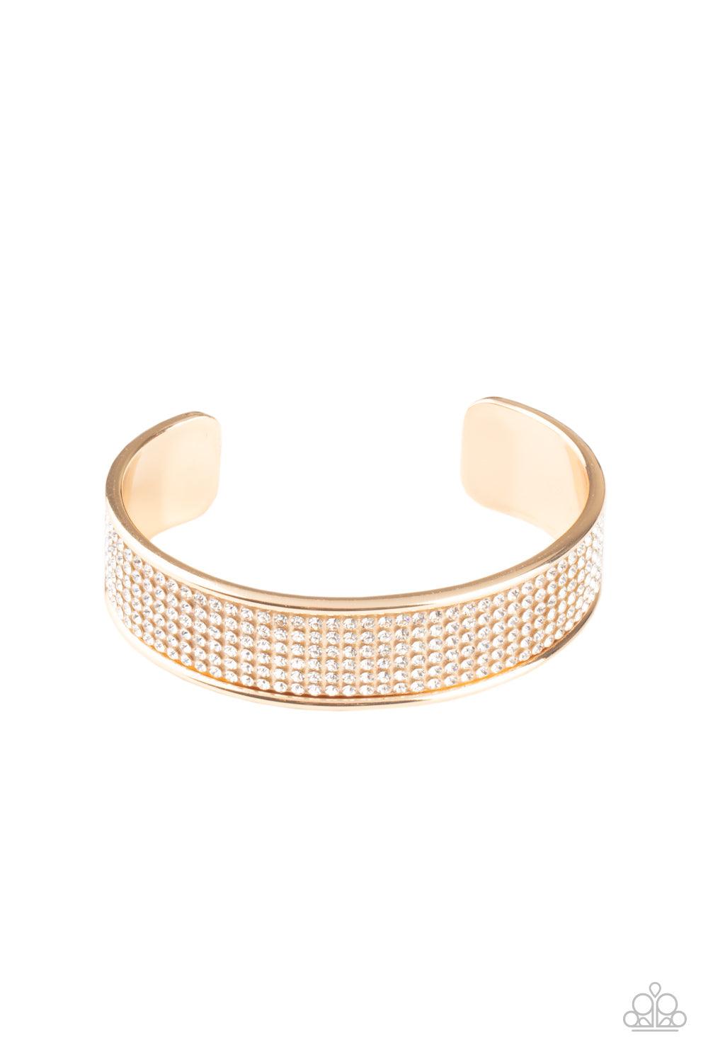 Paparazzi Accessories Cant Believe Your ICE - Gold Row after row of white rhinestones are encrusted along the front of a thick gold cuff, creating a blinding statement piece around the wrist. Sold as one individual bracelet. Jewelry