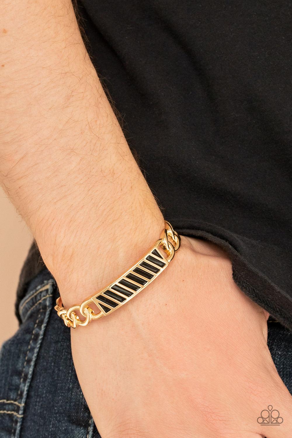 Paparazzi Accessories Keep Your Guard Up - Gold Gold chain-like bars attach to a riveted gold centerpiece, creating a statement-making cuff around the wrist. Sold as one individual bracelet. Jewelry