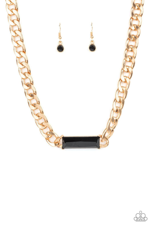 Paparazzi Accessories Urban Royalty - Gold A dramatically oversized row of gold chain attaches to a black emerald cut rhinestone pendant, creating a demanding centerpiece below the collar. Features an adjustable clasp closure. Sold as one individual neckl