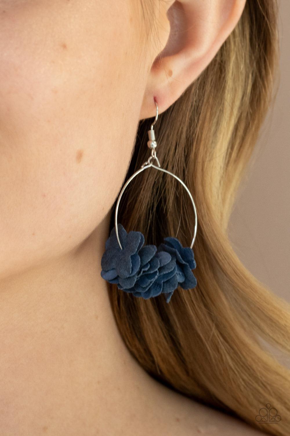 Paparazzi Accessories Flirty Florets - Blue A collection of blue paper-like flowers are threaded along a dainty silver hoop, creating a flirtatious floral fringe. Earring attaches to a standard fishhook fitting. Sold as one pair of earrings. Jewelry