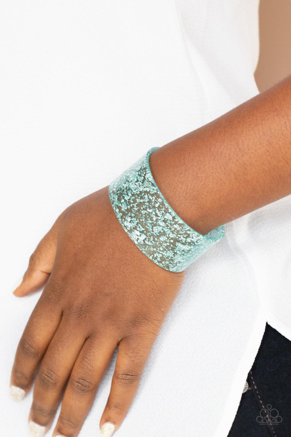 Paparazzi Accessories Snap, Crackle, Pop! - Blue Dainty silvery shavings are encased in a thick blue acrylic cuff, creating an icy incandescence around the wrist. Sold as one individual bracelet. Jewelry