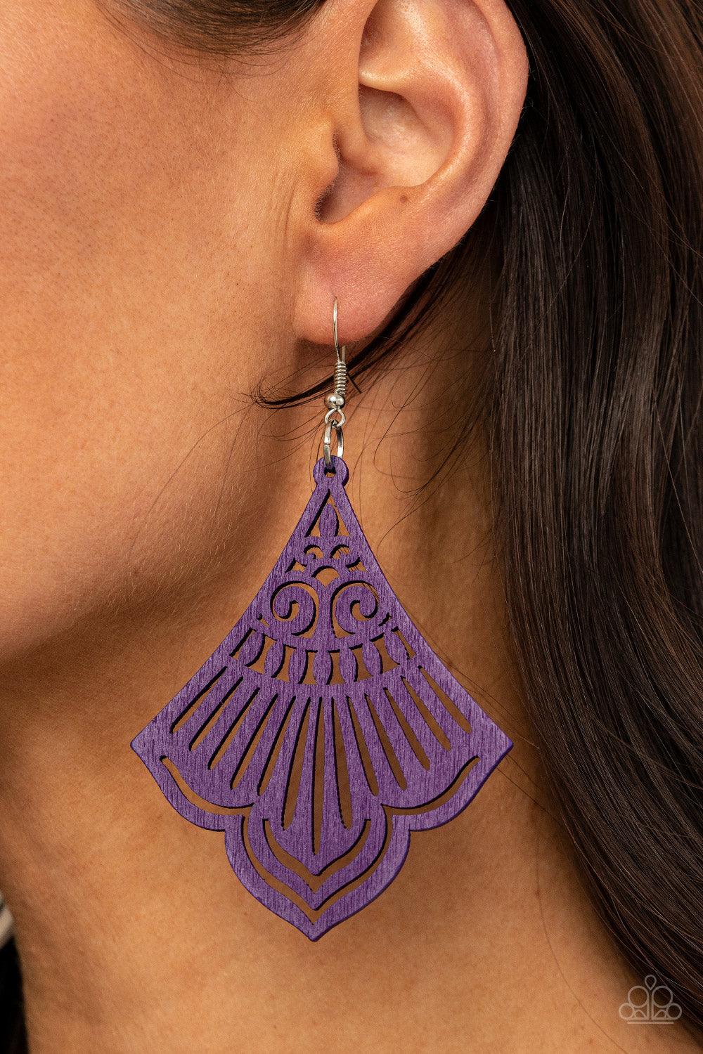 Paparazzi Accessories Eastern Escape - Purple Painted in a vivacious purple finish, a scalloped wooden frame is cutout in airy stenciled details for a whimsical finish. Earring attaches to a standard fishhook fitting. Sold as one pair of earrings. Jewelry