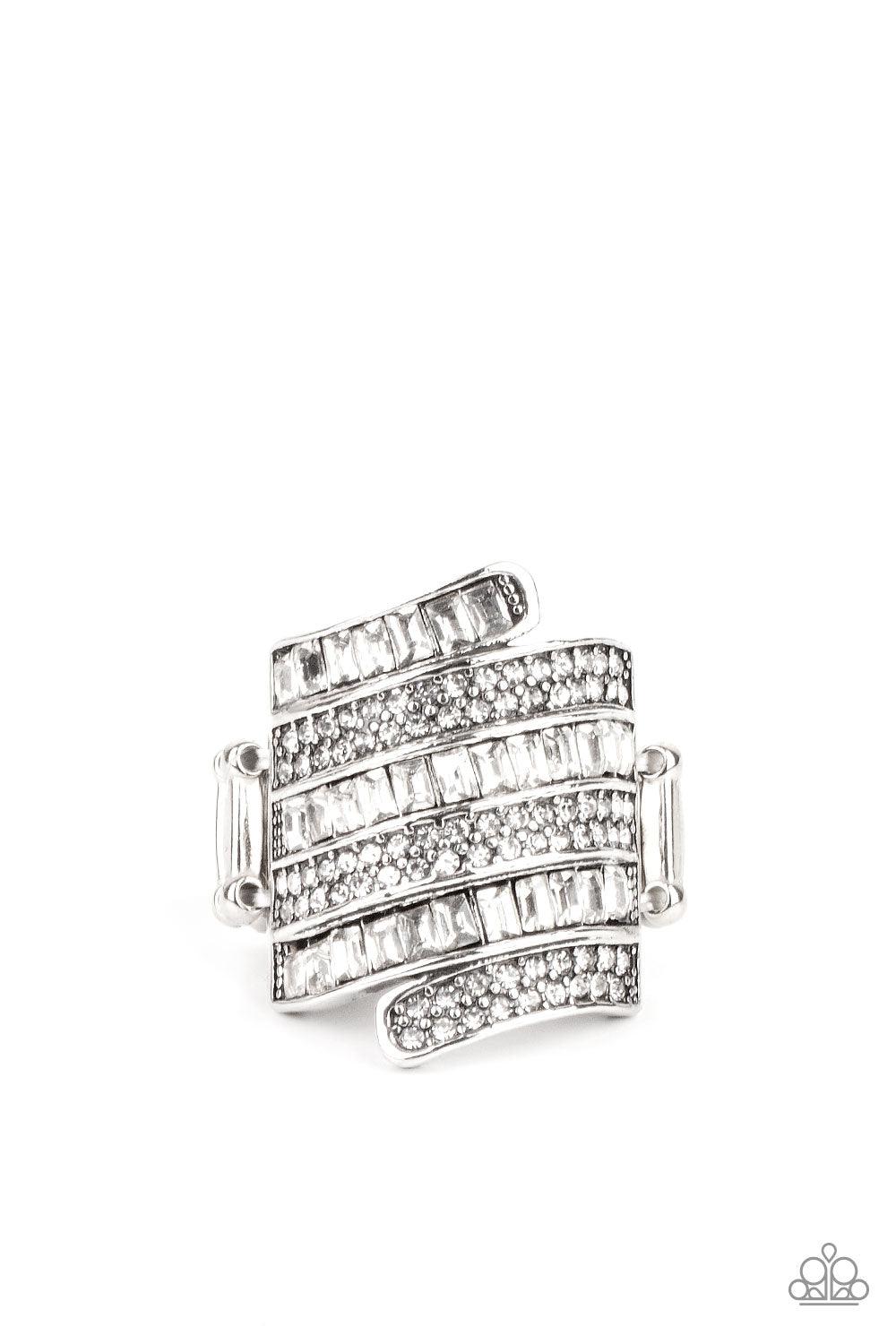 Paparazzi Accessories Hear Me UPROAR - White Dotted with pairs of dainty white rhinestones and glassy emerald cut rhinestones, stacks of silver bands wrap across the front of the finger for a jaw-dropping dazzle. Features a stretchy band for a flexible fi