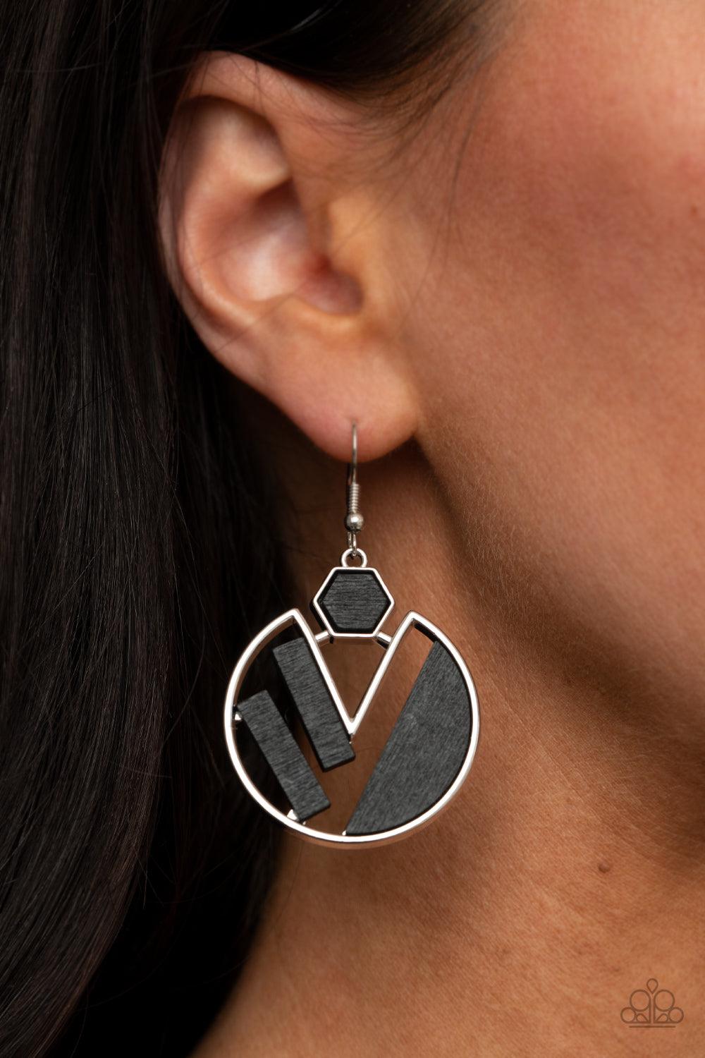 Paparazzi Accessories Petrified Posh - Black Painted in a black finish, flat wooden frames collect inside a geometric sliver fitting for a trendy fashion. Earring attaches to a standard fishhook fitting. Sold as one pair of earrings. Jewelry