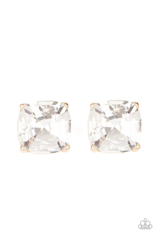 Paparazzi Accessories Royalty High - Gold A dramatically oversized white gem is nestled atop a pronged gold frame, creating a jaw-dropping dazzle. Earring attaches to a standard post fitting. Sold as one pair of post earrings. Jewelry