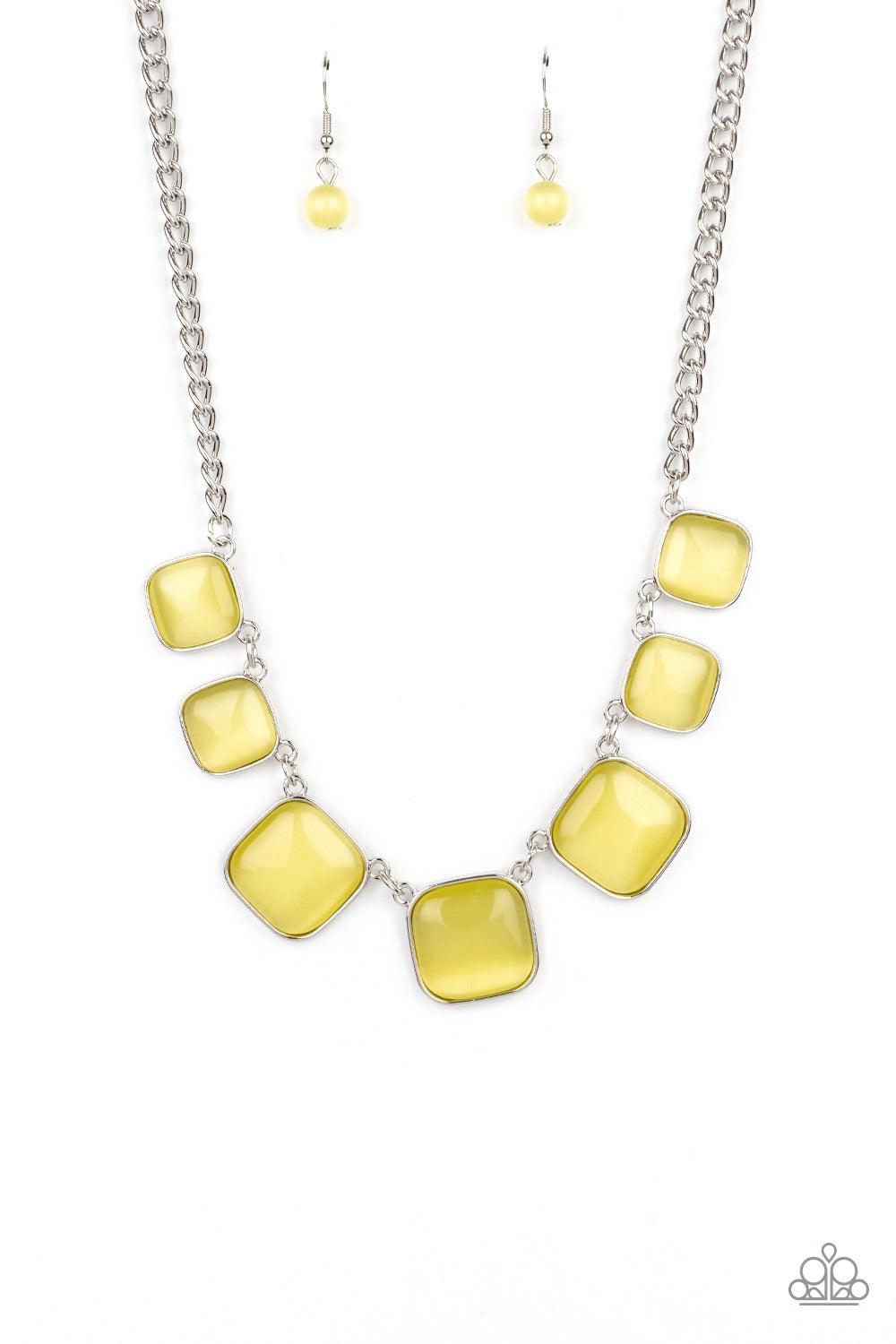 Paparazzi Accessories Aura Allure - Yellow Encased in square silver fittings, a dewy collection of Illuminating cat's eye stones gradually increase in size as they link below the collar for a whimsical pop of color. Features an adjustable clasp closure. S