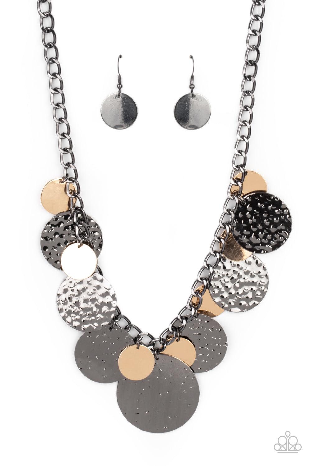 Paparazzi Accessories Industrial Grade Glamour - Multi Oversized gold discs and hammered gunmetal discs swing from the bottom of a chunky gunmetal chain, creating a rambunctious fringe below the collar. Features an adjustable clasp closure. Sold as one in