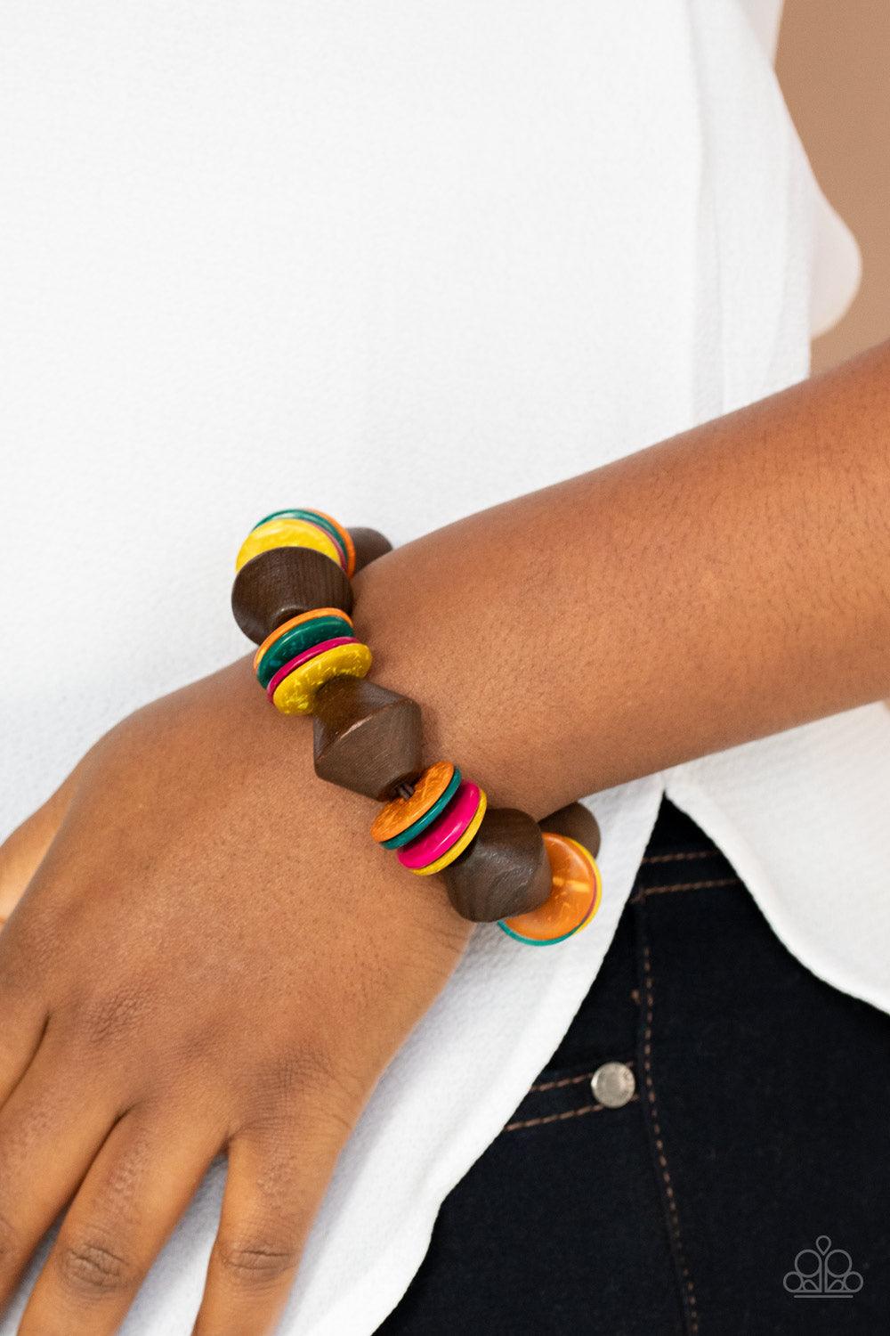 Paparazzi Accessories Bermuda Boardwalk - Multi Multicolored wooden discs and chunky brown wooden beads are threaded along a stretchy band around the wrist, creating a summery look. Sold as one individual bracelet. Jewelry