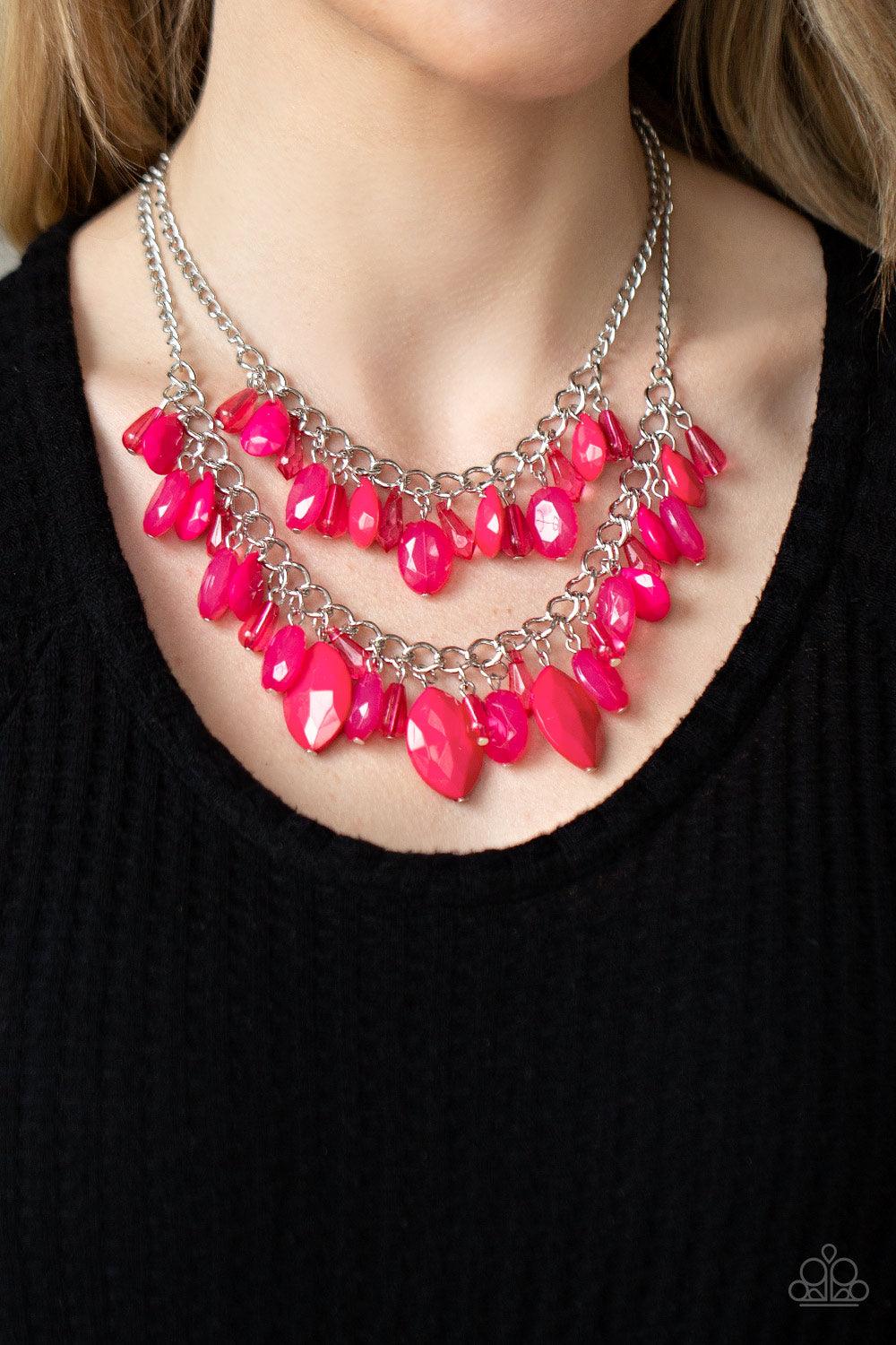 Paparazzi Accessories Midsummer Mixer - Pink Varying in opacity, a vivacious collection of pink oval and teardrop acrylic and crystal-like beads cascade from two bold silver chains below the collar for a flirtatiously layered look. Features an adjustable