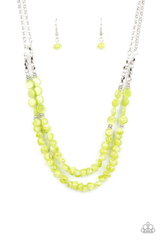 Paparazzi Accessories Staycation Status - Green Infused with dainty silver cube and round beaded accents, green shell-like beads are threaded along invisible wires below the collar for a summery inspiration. Features an adjustable clasp closure. Sold as o