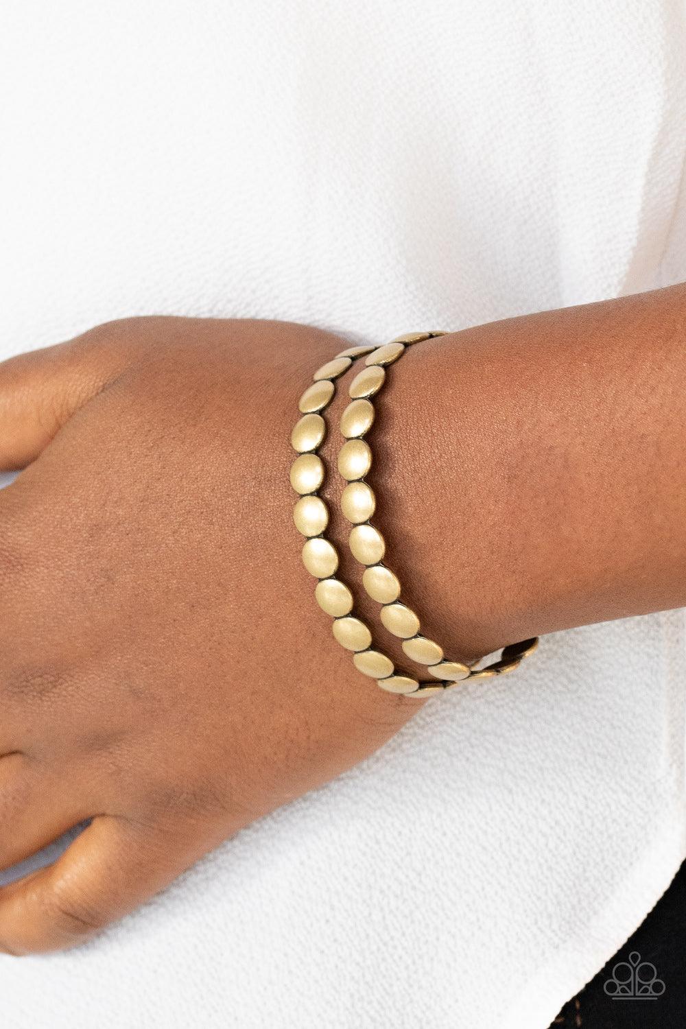 Paparazzi Accessories On The Spot Shimmer - Brass Brushed in an antiqued finish, rows of flattened brass studs coalesce into a rustic cuff around the wrist. Sold as one individual bracelet. Jewelry
