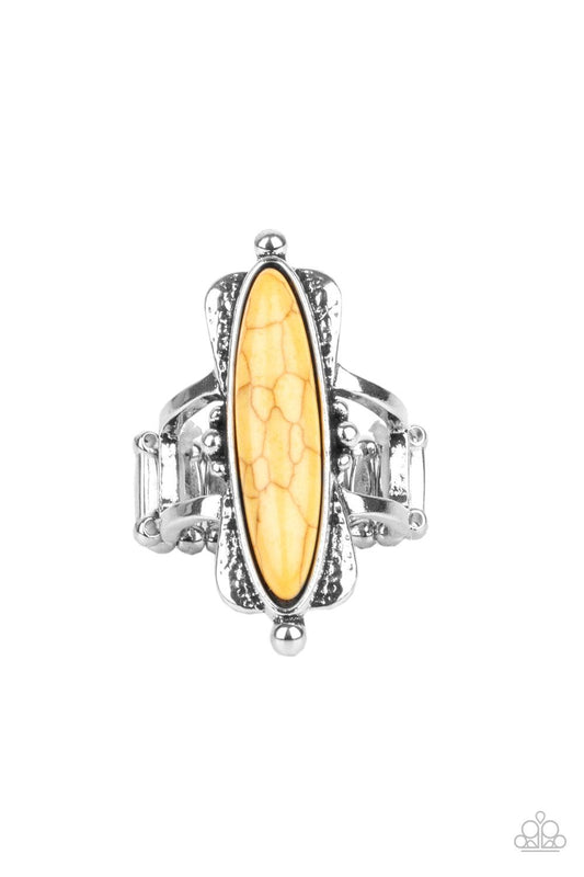 Paparazzi Accessories Cottage Craft - Yellow An oblong yellow stone is pressed into a flared silver frame featuring studded accents, creating an abstract centerpiece atop the finger. Features a stretchy band for a flexible fit. Sold as one individual ring