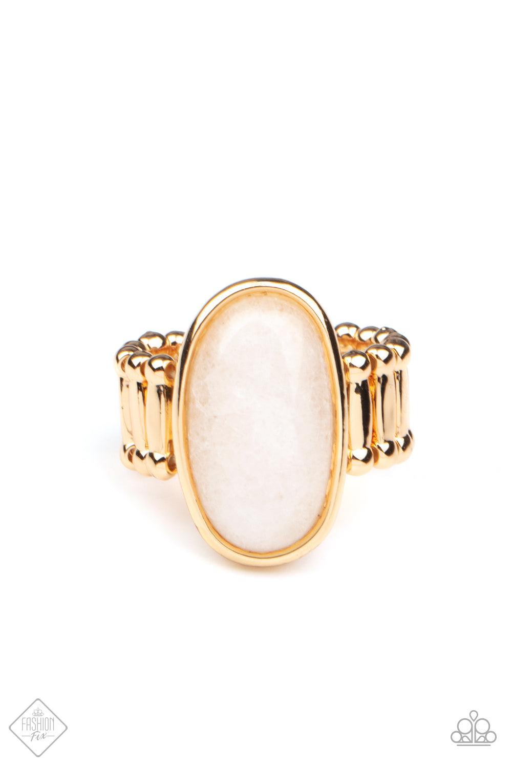 Paparazzi Accessories Mystical Mantra - Gold A white oval stone is encased inside a sleek gold frame, creating a mystical centerpiece atop the finger. Features a stretchy band for a flexible fit. Sold as one individual ring. Jewelry