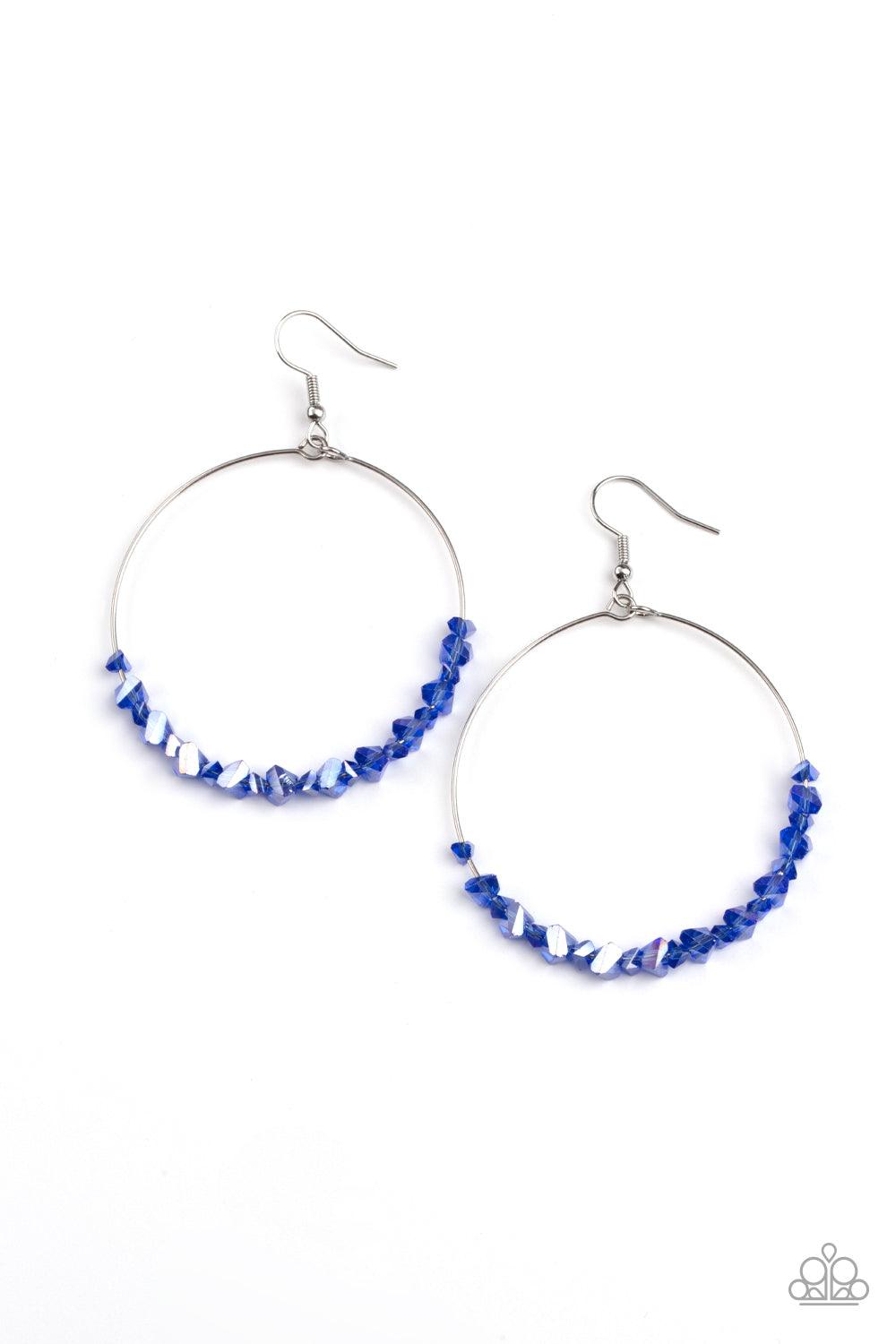 Paparazzi Accessories Glimmering Go-Getter - Blue Featuring an iridescent shimmer, jagged bits of glassy blue rocks are threaded along the bottom of a dainty silver hoop for a colorful look. Earring attaches to a standard fishhook fitting. Sold as one pai