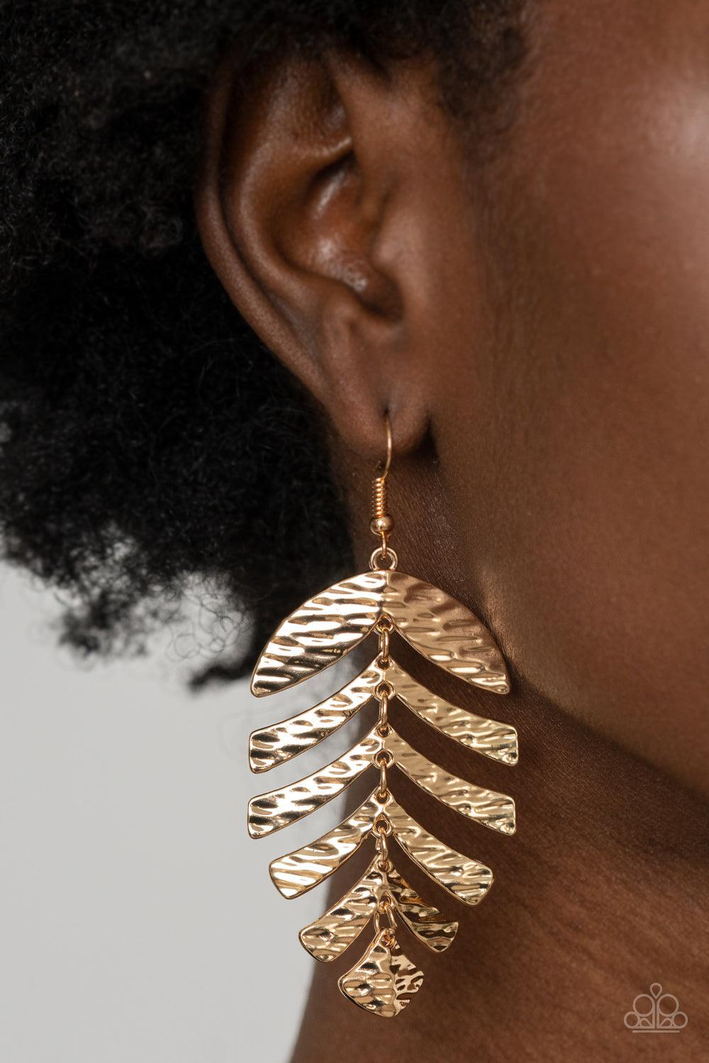 Paparazzi Accessories Palm Lagoon - Gold Rippling with tactile textures, dainty gold frames link into a dancing palm leaf for a simply seasonal fashion. Earring attaches to a standard fishhook fitting. Sold as one pair of earrings. Jewelry