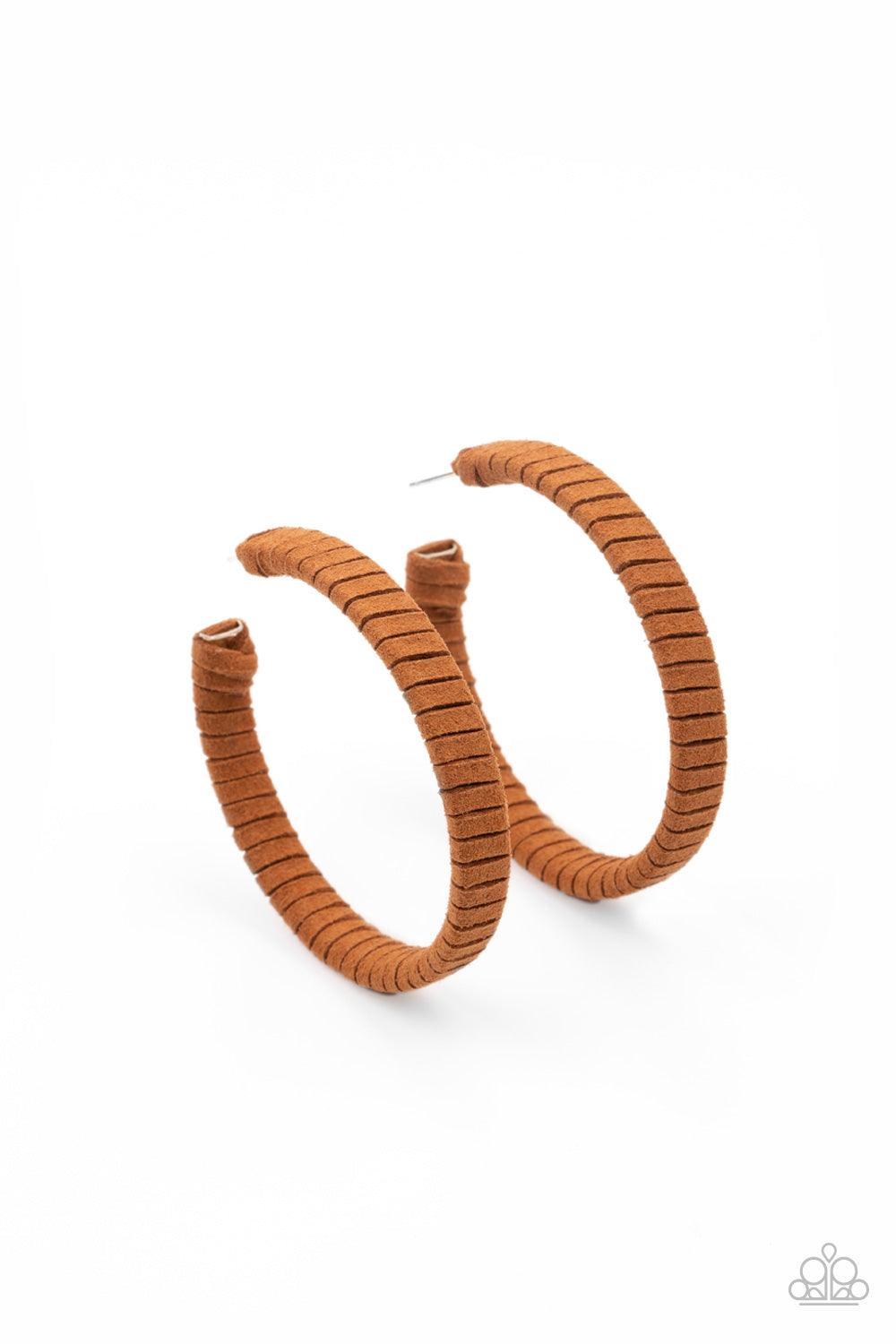 Paparazzi Accessories Suede Parade - Brown Tan suede cording wraps around an oversized hoop, creating an earthy pop of color. Earring attaches to a standard post fitting. Hoop measures approximately 2 1/4" in diameter. Sold as one pair of hoop earrings. J